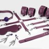 Набір Feral Feelings BDSM Kit 7 Burgundy, наручники, поножі, конектор, маска, паддл, кляп, затискачі